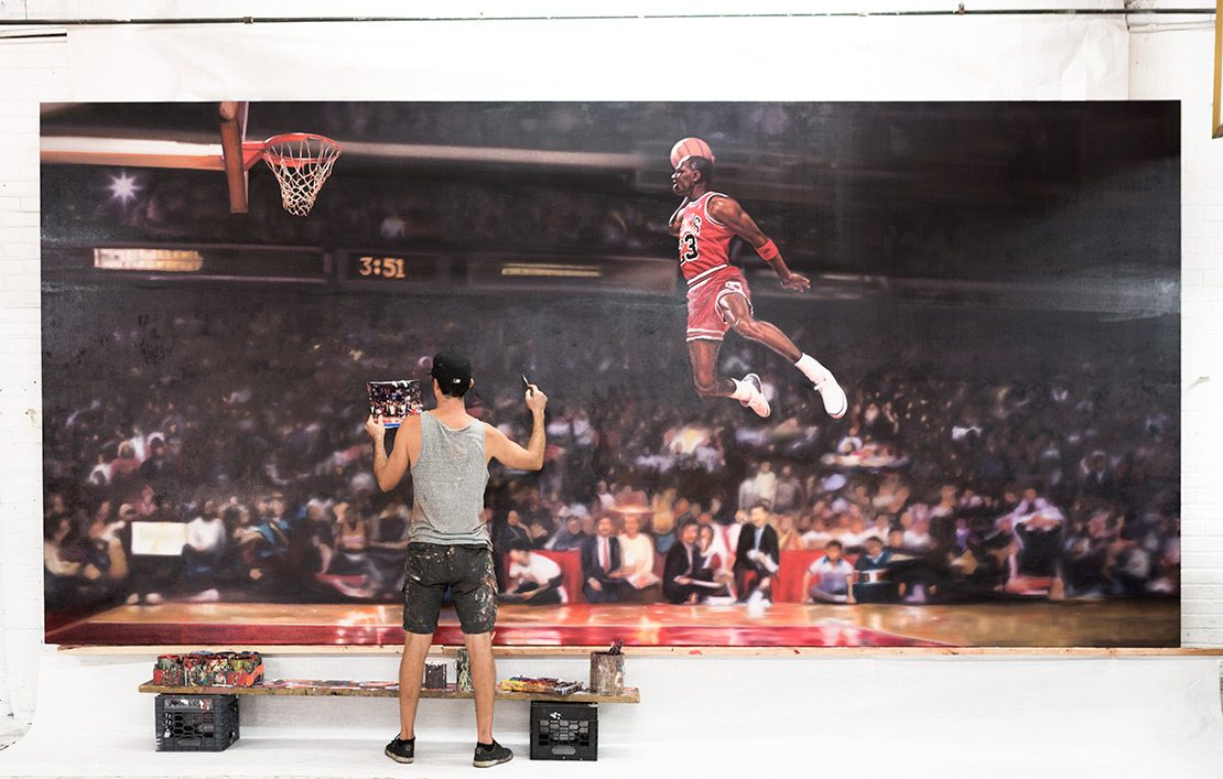Hand painting the photorealistic Nike mural