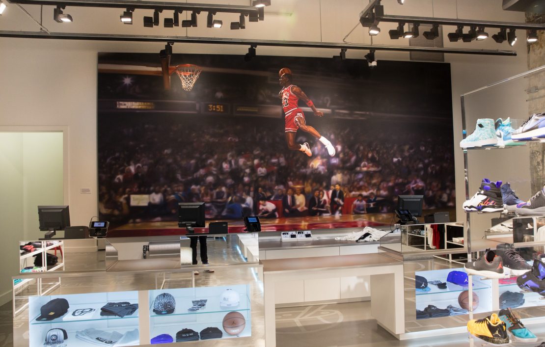 Nike store mural hand-painted by Colossal Media.