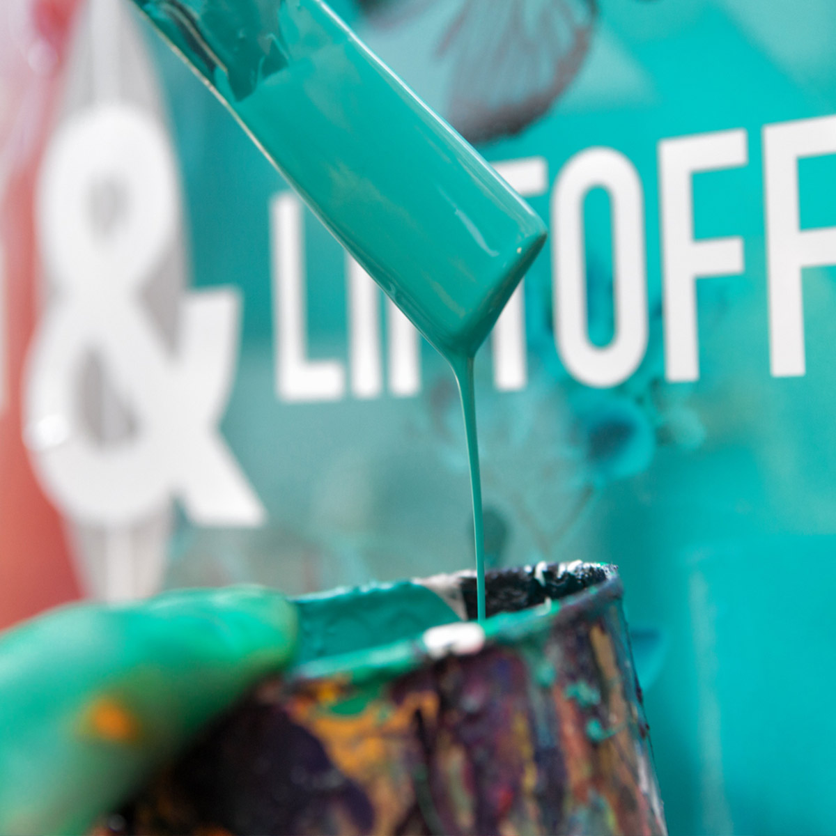 Mixing cyan paint for the Puma mural