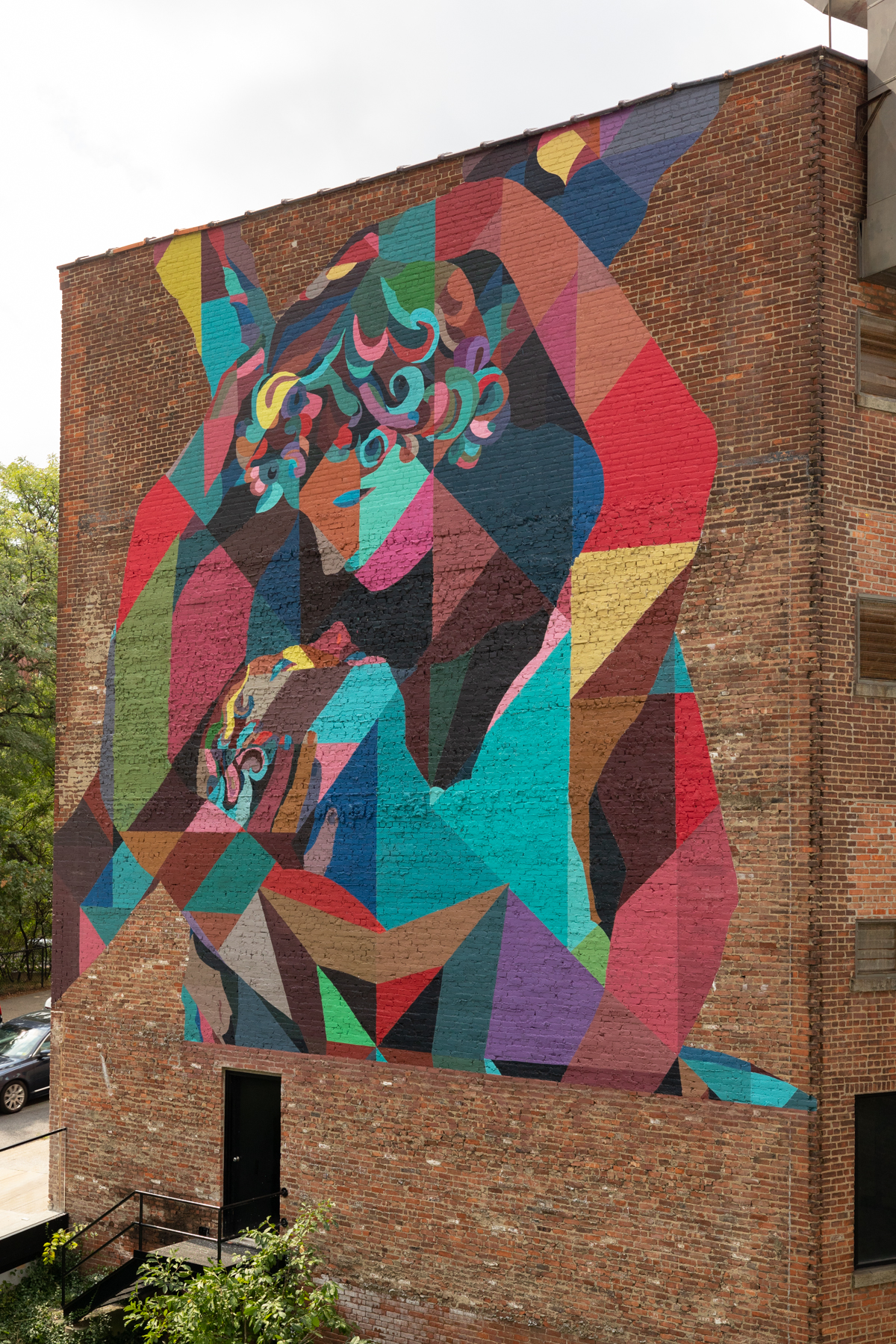 Colossal Media hand-painted mural in Dumbo Brooklyn, NY, with art by Finley.