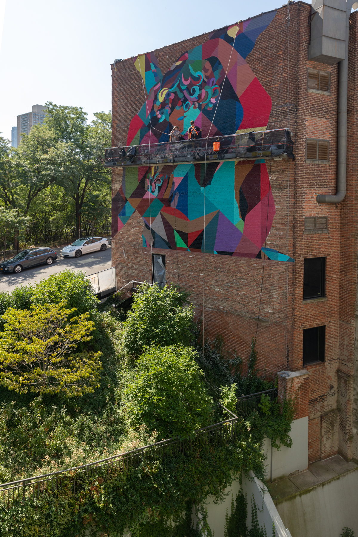 Colossal Media hand-painted mural in Dumbo Brooklyn, NY, with art by Finley.